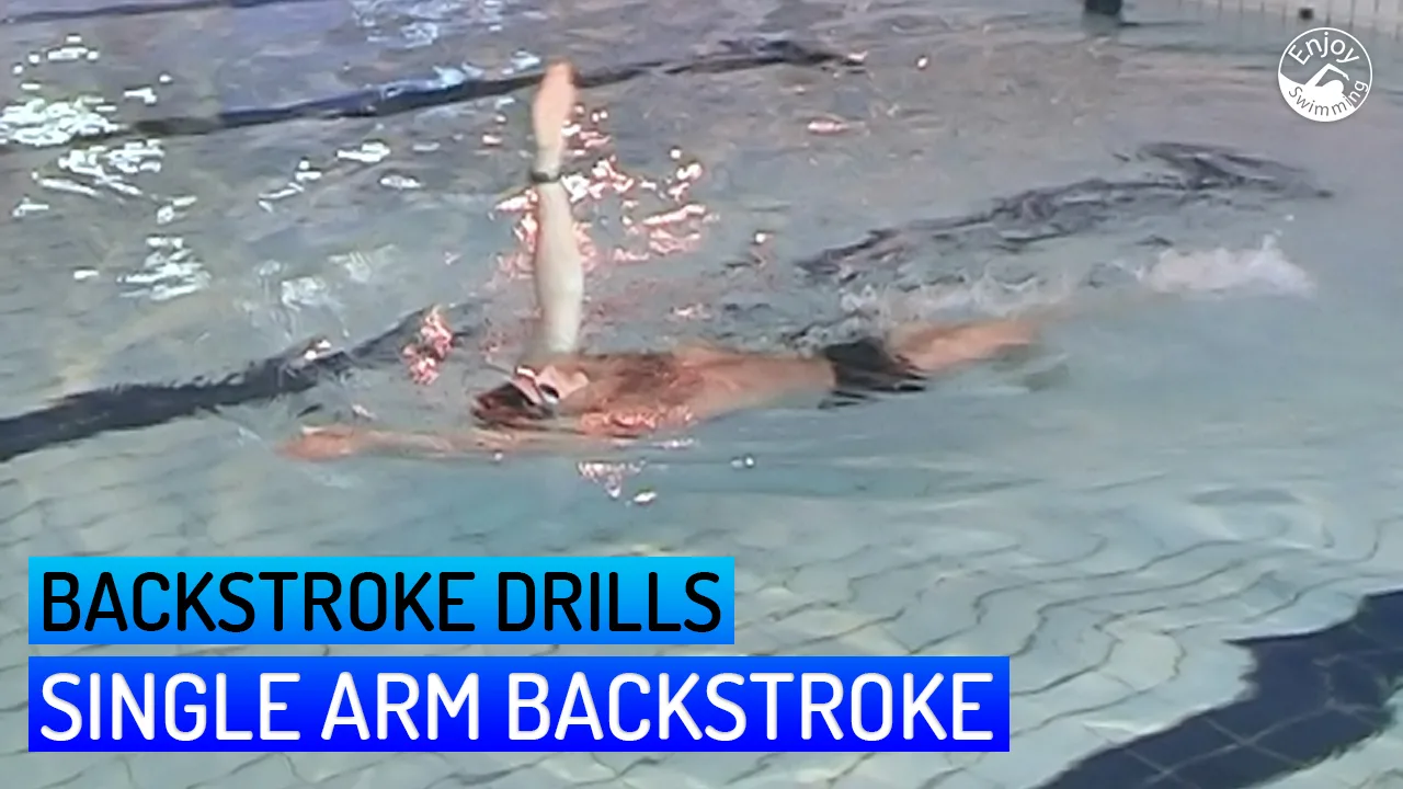 A novice swimmer practicing a single arm backstroke drill