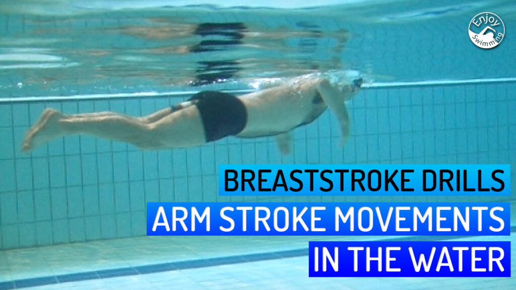 A novice swimmer who practices the breaststroke arm movements while holding a pull buoy between his legs