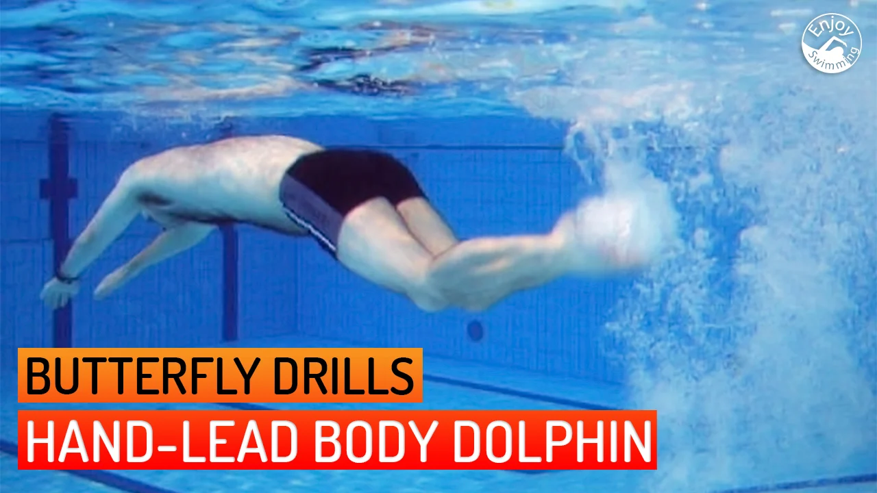 A swimmer practicing the Hand-Lead Body Dolphin drill for the butterfly stroke.