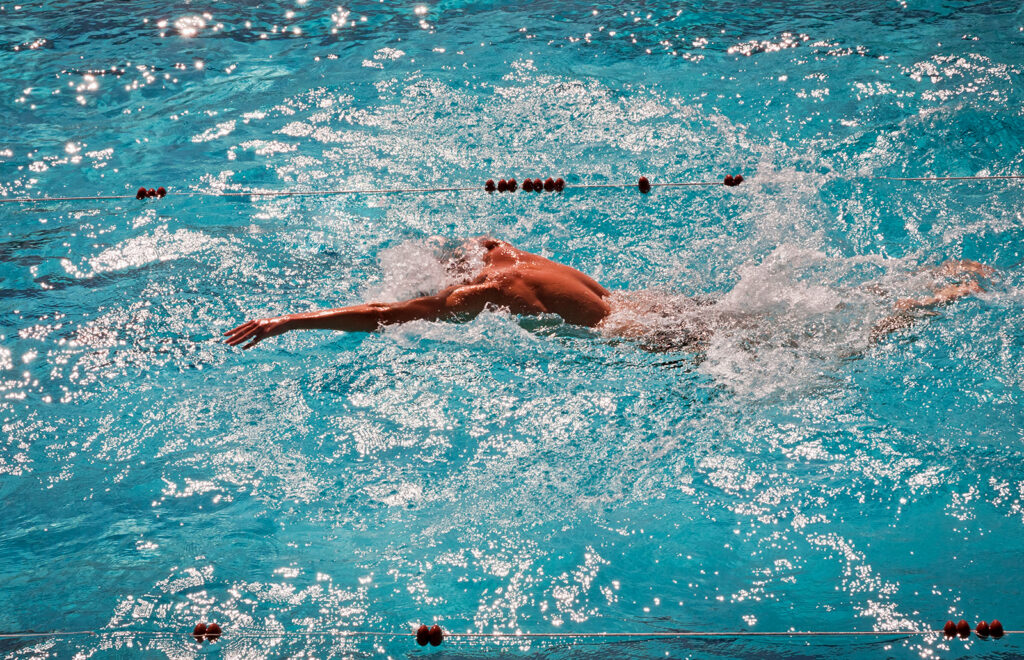 A swimmer practicing the one-armed butterfly drill.