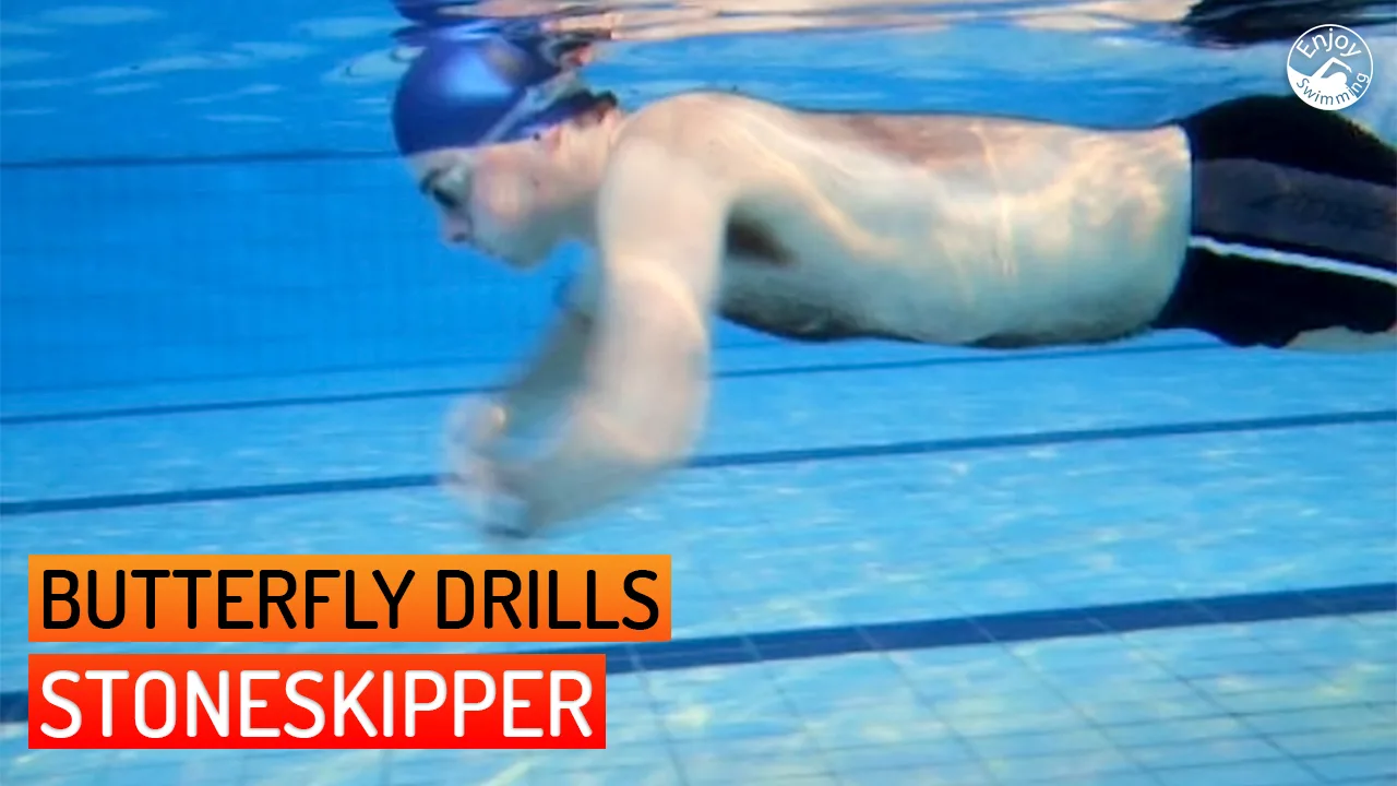 A swimmer practicing the Stoneskipper drill for the butterfly stroke.