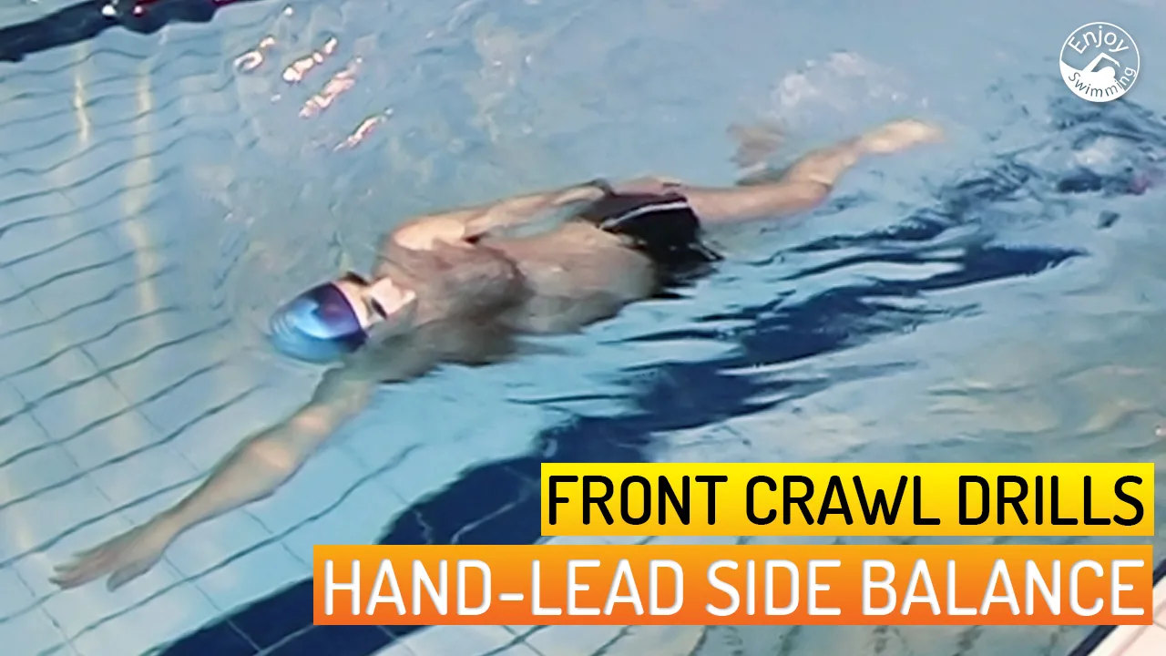 A novice swimmer who practices the head-lead side balance drill for the front crawl stroke.
