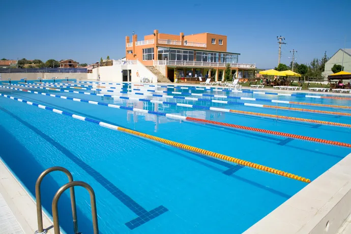 Beautiful sunny view of an outdoor swimming facility.